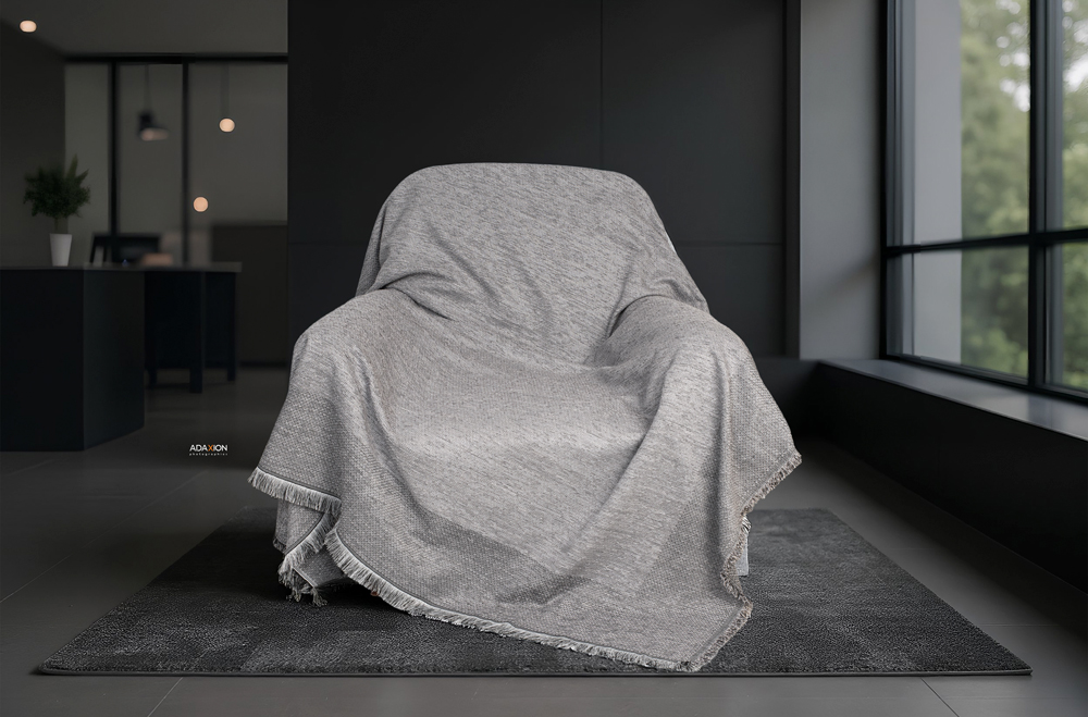 professional photoshoot of sofa throw blanket – textured fabric, detailed pattern, product photography for home textiles